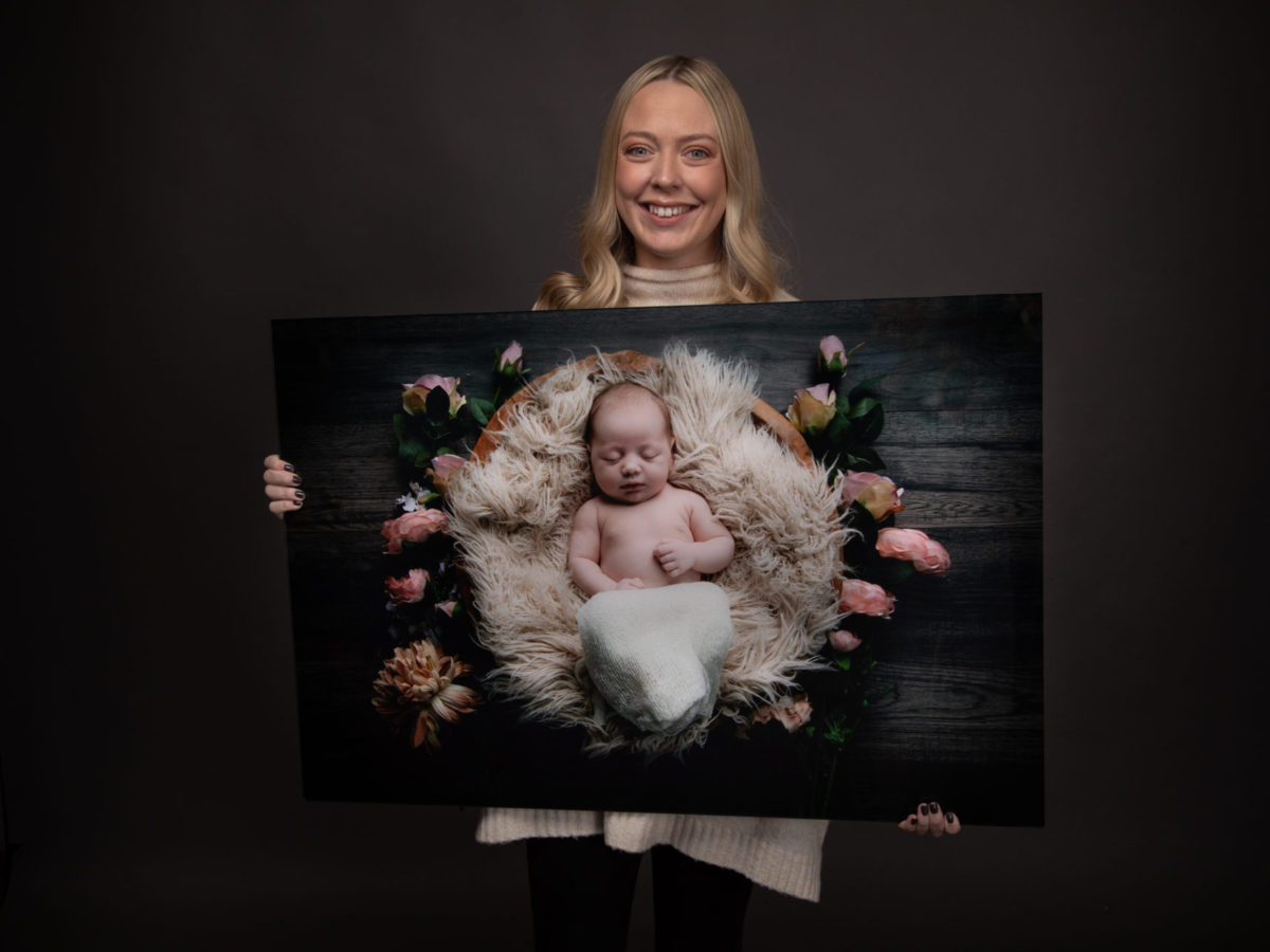 Mother holding newborn canvas at chocolate chip